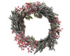 Couronne de Noël givrée baies rouges et pommes de pin